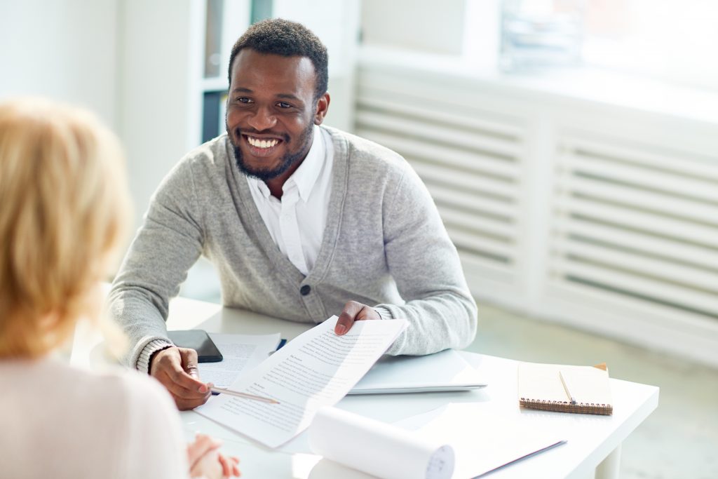 An image of a bank teller for our FAQ on How to Become a Bank Teller