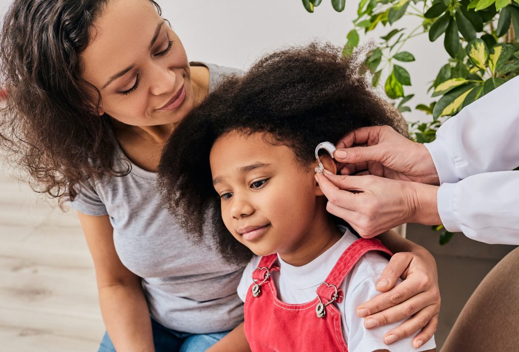 An image of an audiologist and patient for our FAQ on What Is the Best Degree Path for Becoming an Audiologist