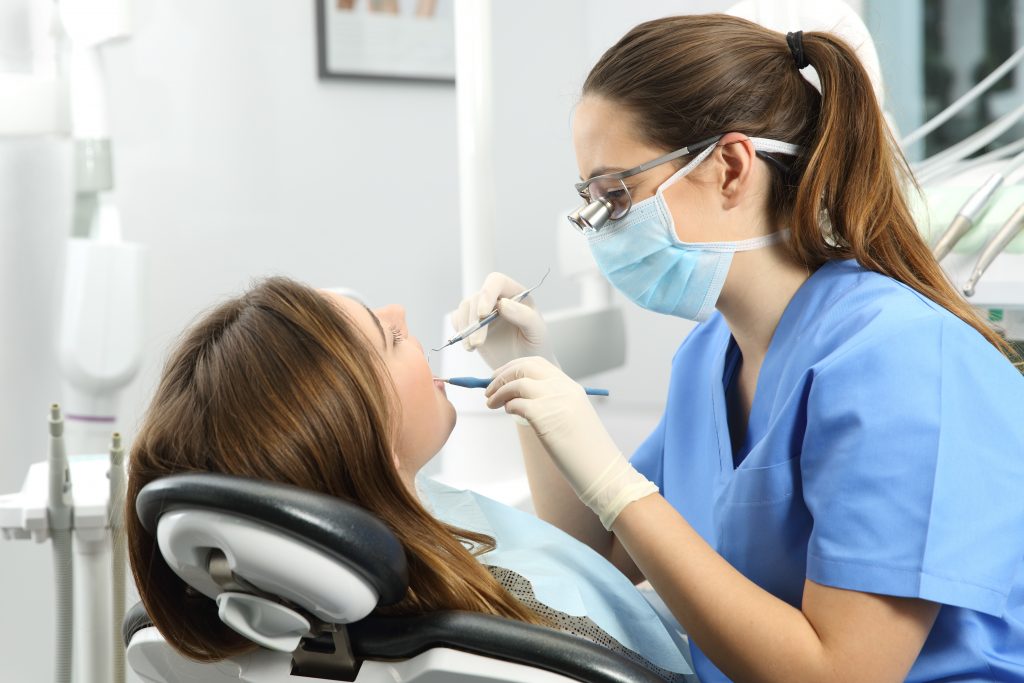 An image of a dental hygienist for our FAQ on What Is the Best Degree Path for Becoming a Dental Hygienist