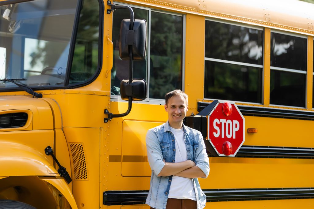 An image of a school bus driver for our FAQ on What Is the Best Degree Path for Becoming a Bus Driver