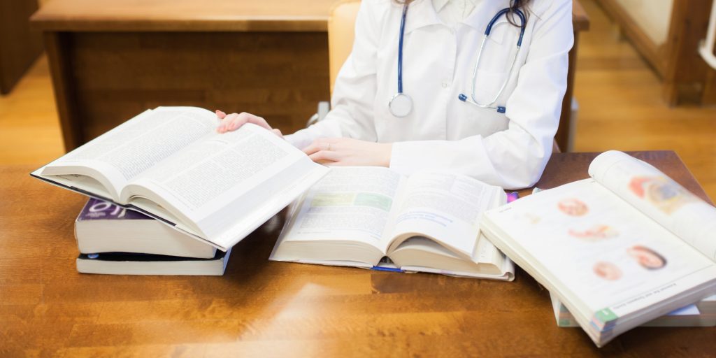 An image of medical books for our article on Best Bachelor Degrees for Med School