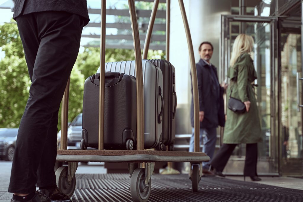 An image of hotel guests and luggage for our article on How Does a CHIA Certification Help Your Career in the Hotel Field