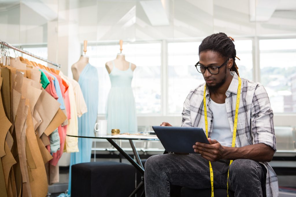 An image of a Black male fashion designer for our FAQ on What is the Best Fashion Designer Degree to Get