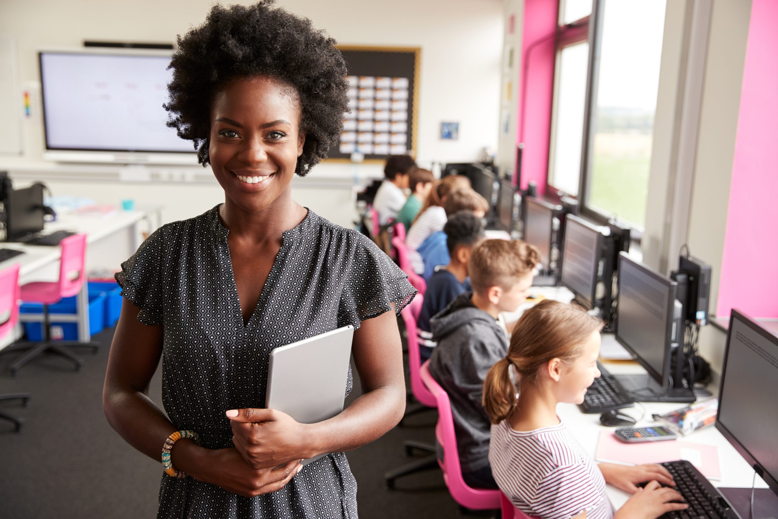An image of a Black female teacher for our ranking of 30 Best Online Bachelor’s in Elementary Education or Early Childhood Education