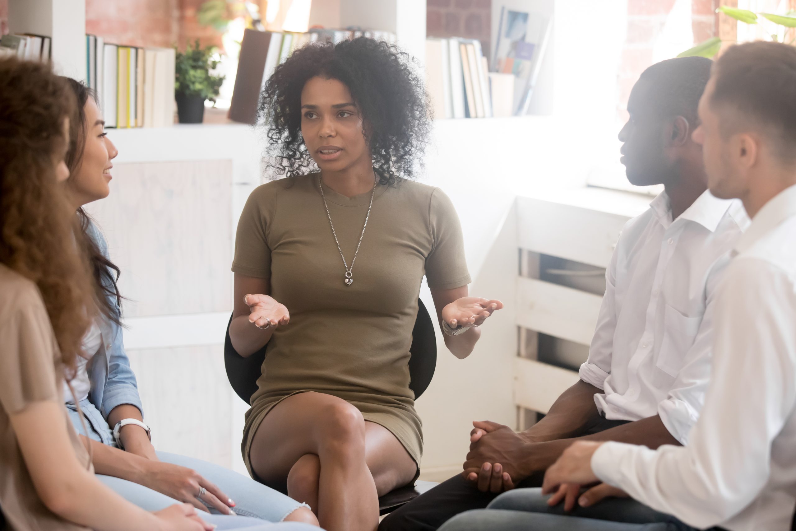 An image of a Black psychologist and students for our ranking of 30 Best Online Bachelor’s in Psychology Programs at Private Colleges