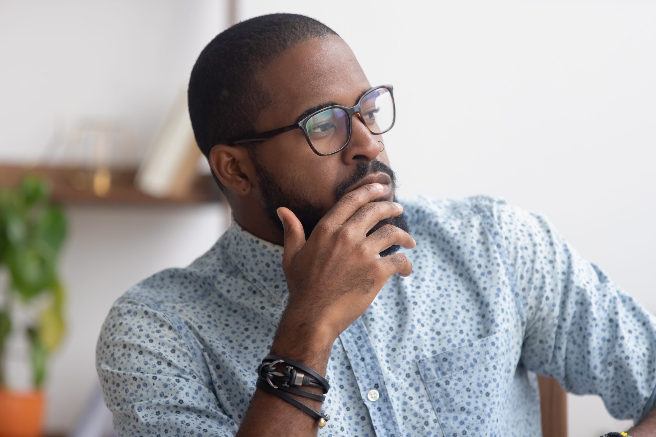 An image of a man thinking for our ranking of Top 20 Majors and Degrees for Thinkers Looking for Intellectual Jobs