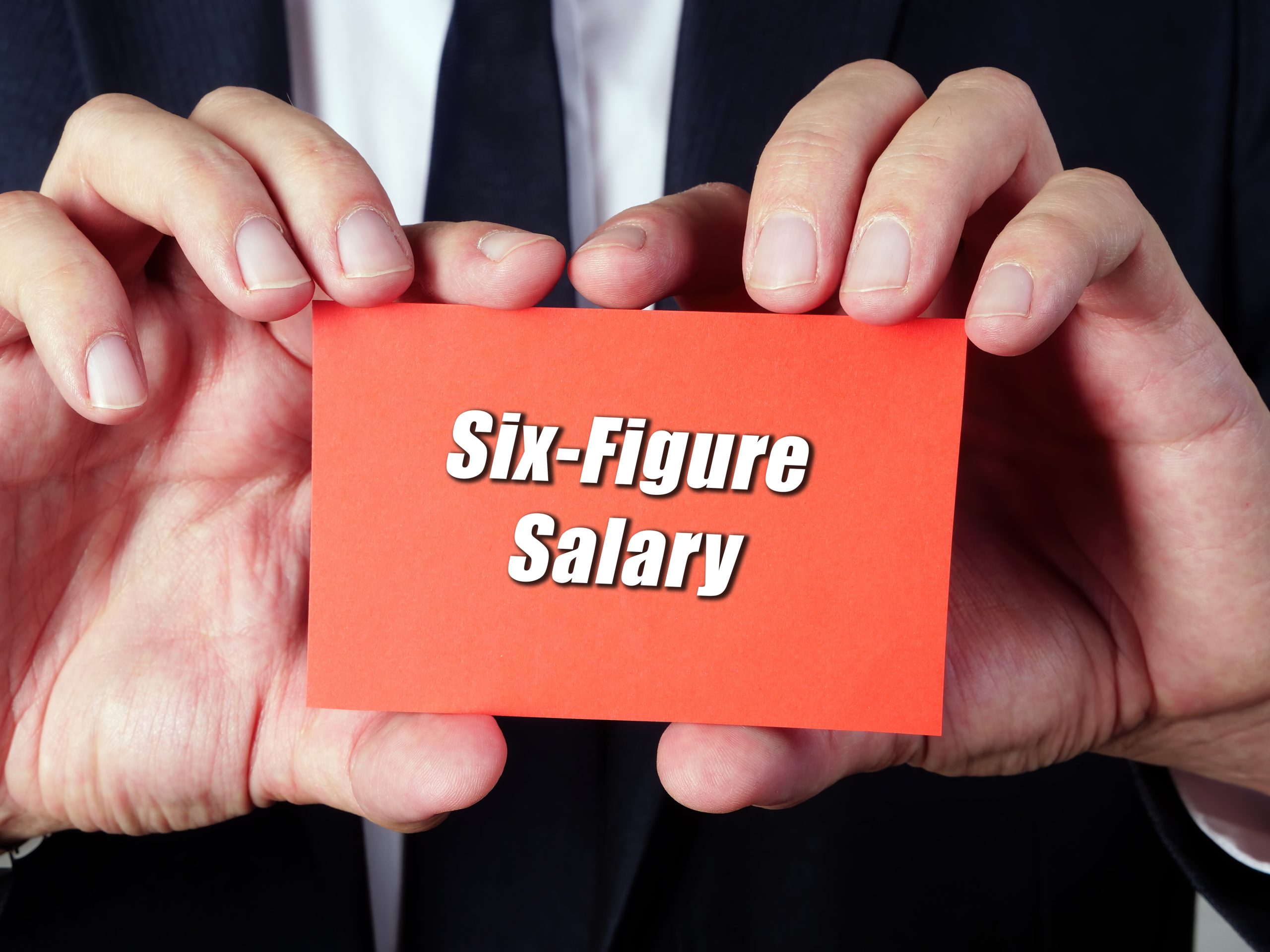 Image of a six-figure salary sign for our FAQ on Is a Master’s Degree Necessary to Earn a Six-Figure Salary
