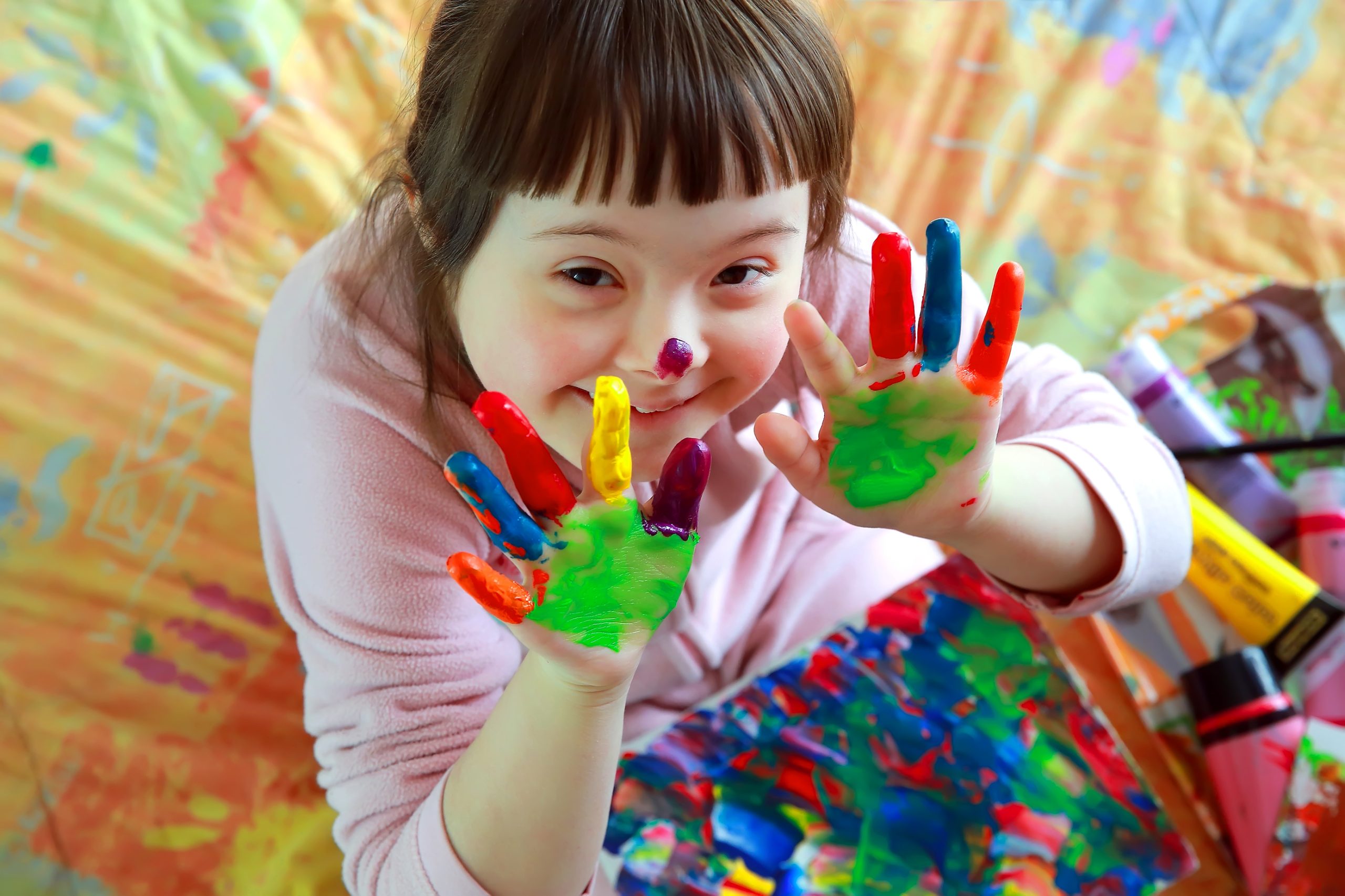 Young child painting for our ranking of 30 Best Online Bachelor’s in Special Education Degree Programs