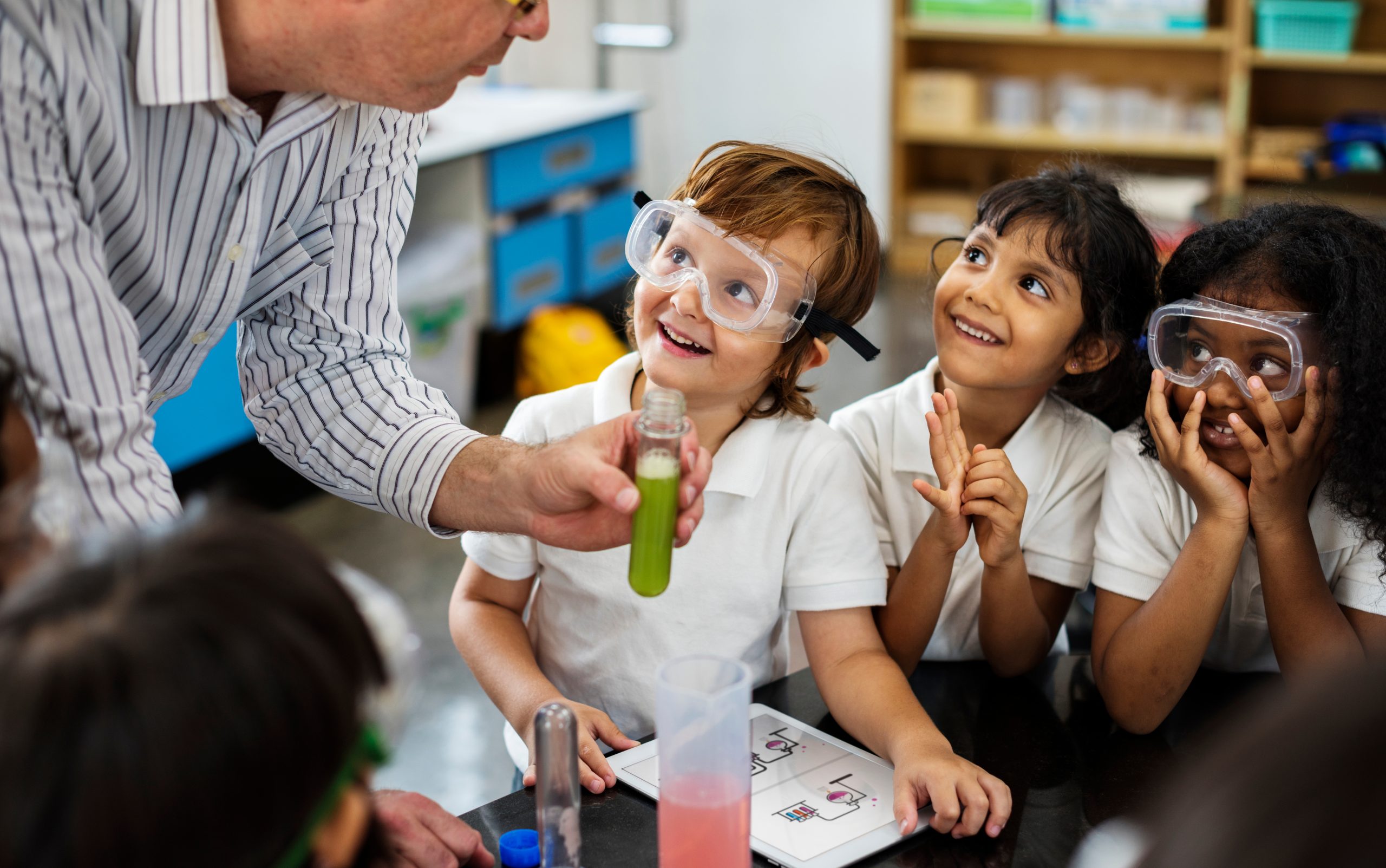 An image of a teacher and students for our ranking of 30 Best Online Bachelor’s in Elementary Education or Early Childhood Education from Private Colleges