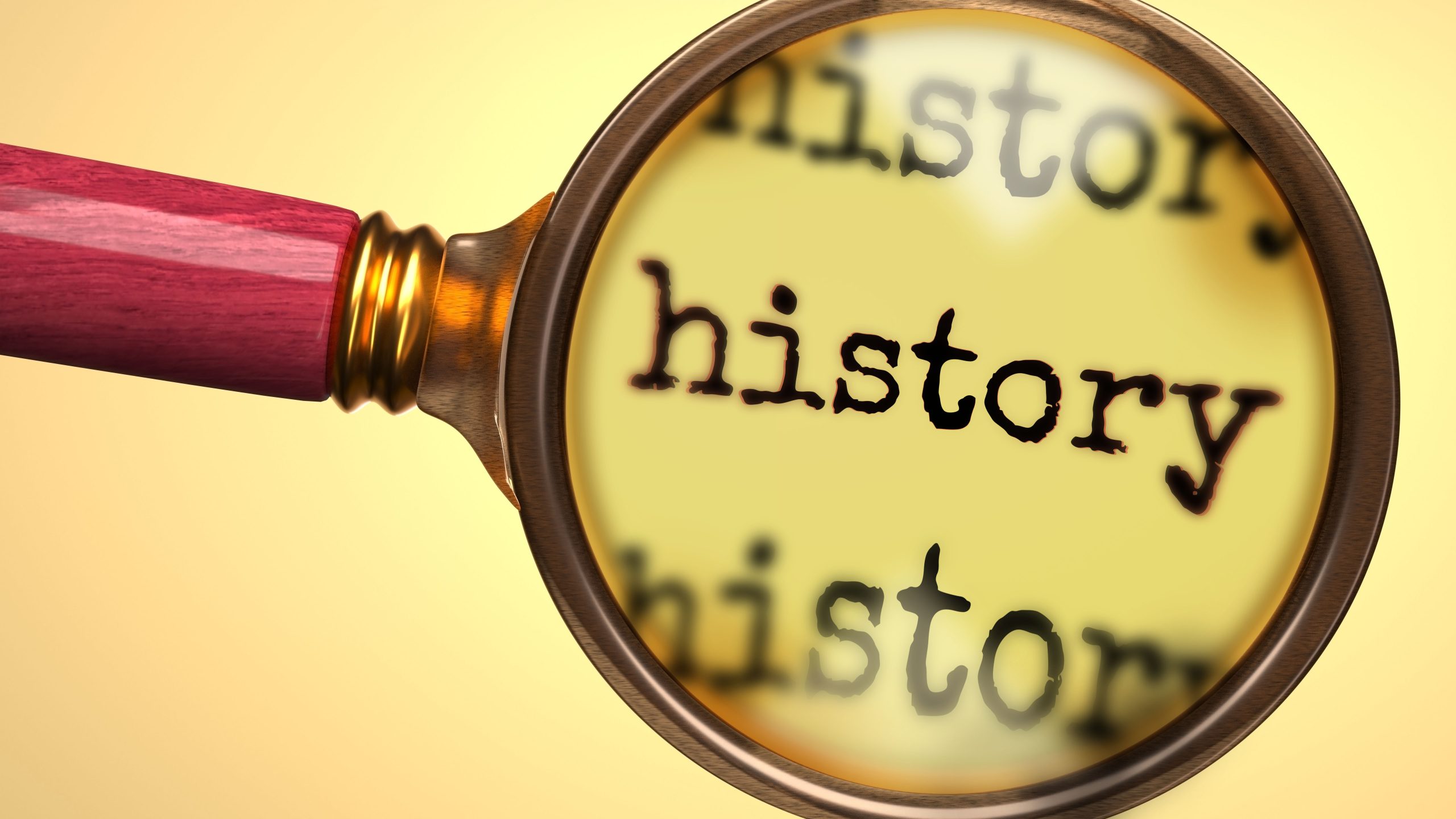 Image of a magnifying glass over the word history for our FAQ on What Jobs Can You Get With a History Degree