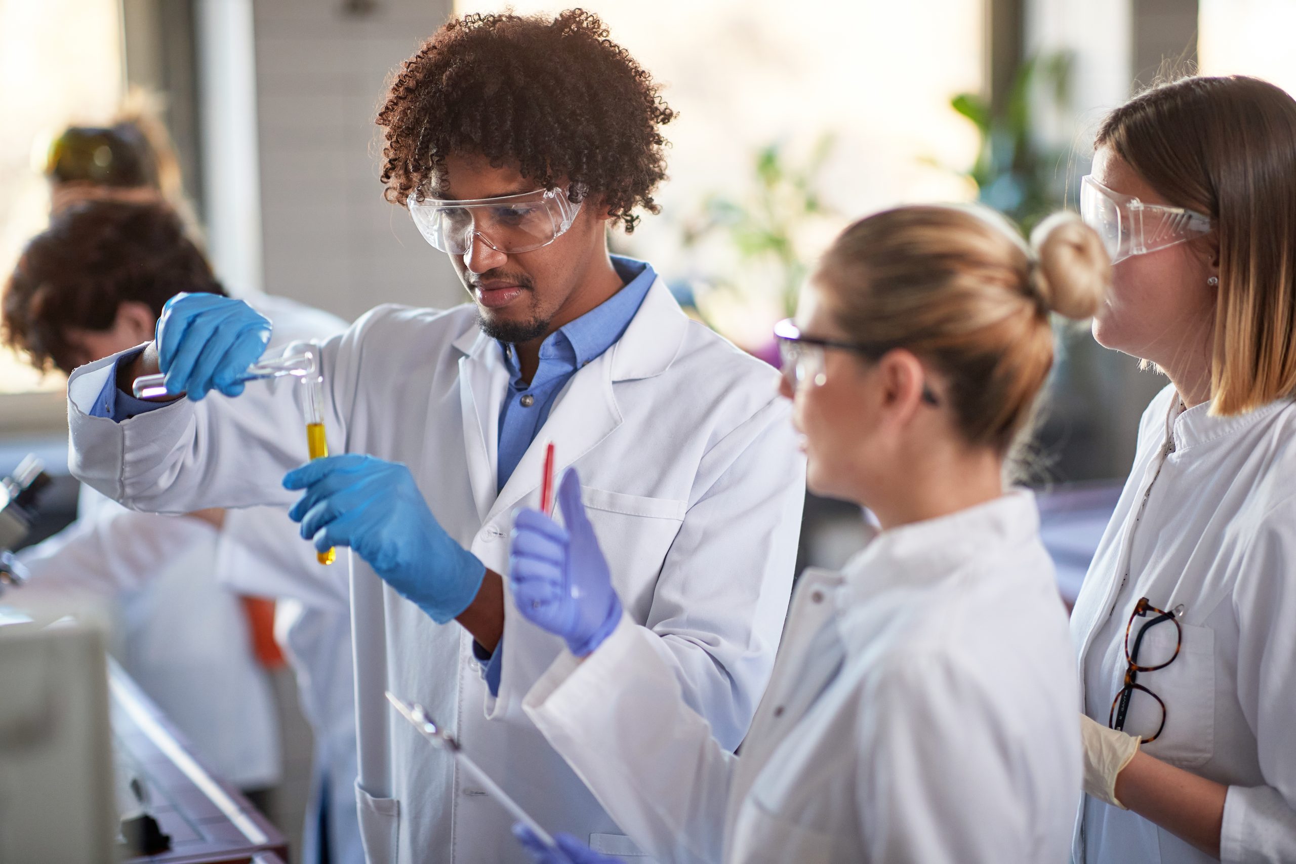 Image of lab workers for our FAQ on What Is the Best Degree Path for Becoming an Epidemiologist