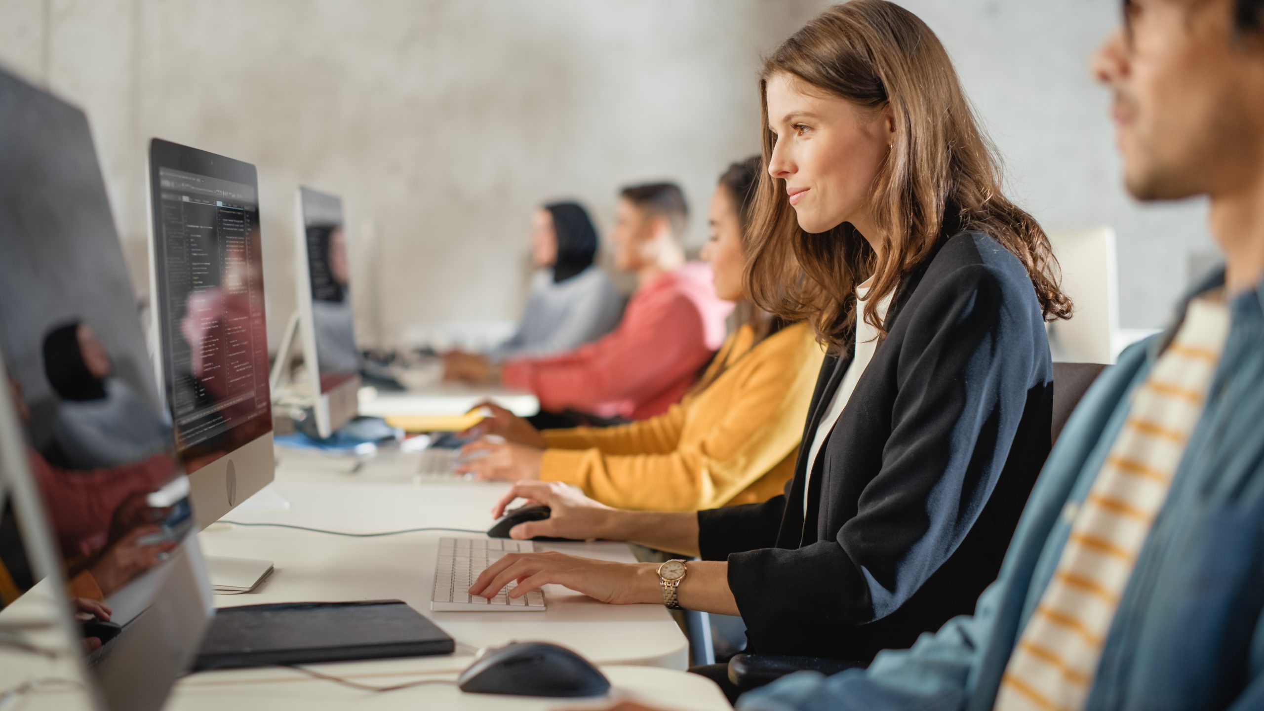 Image of computer students for our FAQ on What is the Best Degree Path for Becoming a Computer Systems Administrator