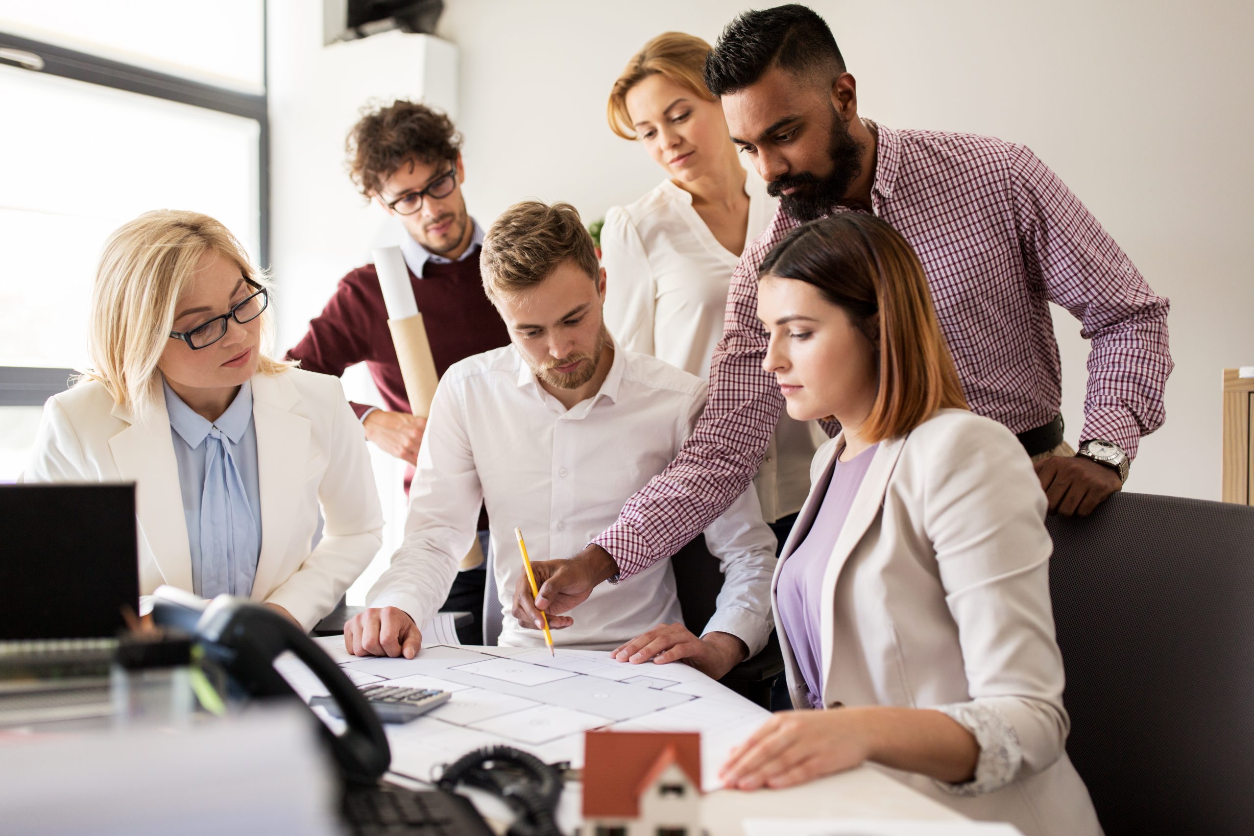 Image of international business team for our FAQ on Should I Choose a U.S.-Based School or a Global University to Study International Business Online